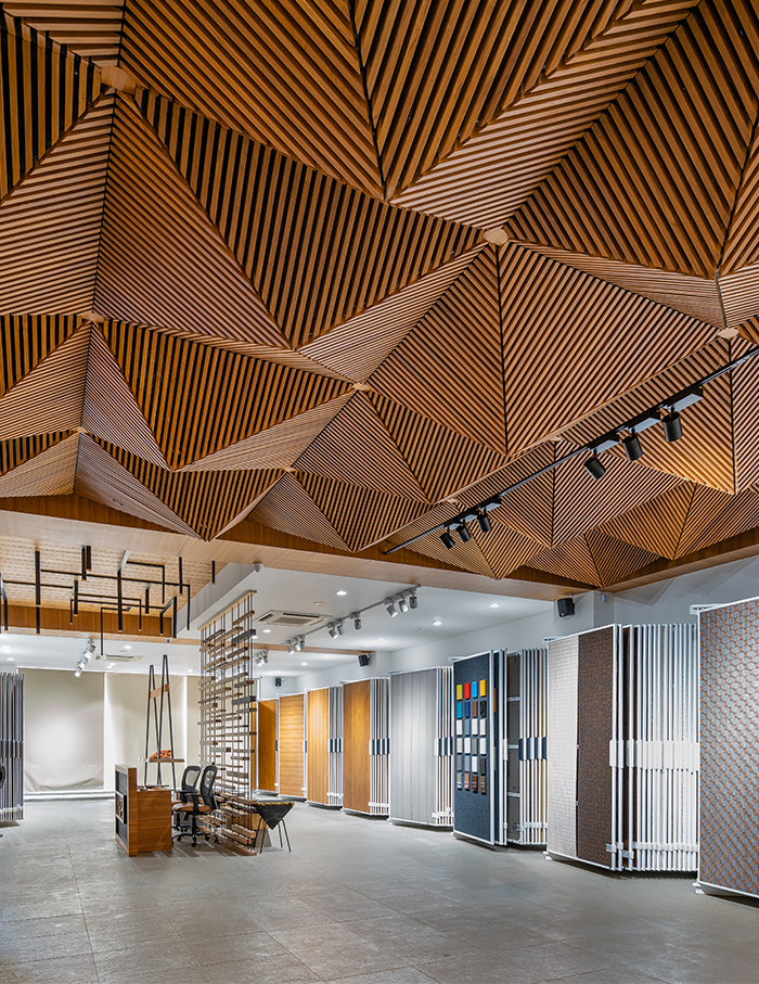 This veneer showroom planned by Marigold Interiors uses wood in ...