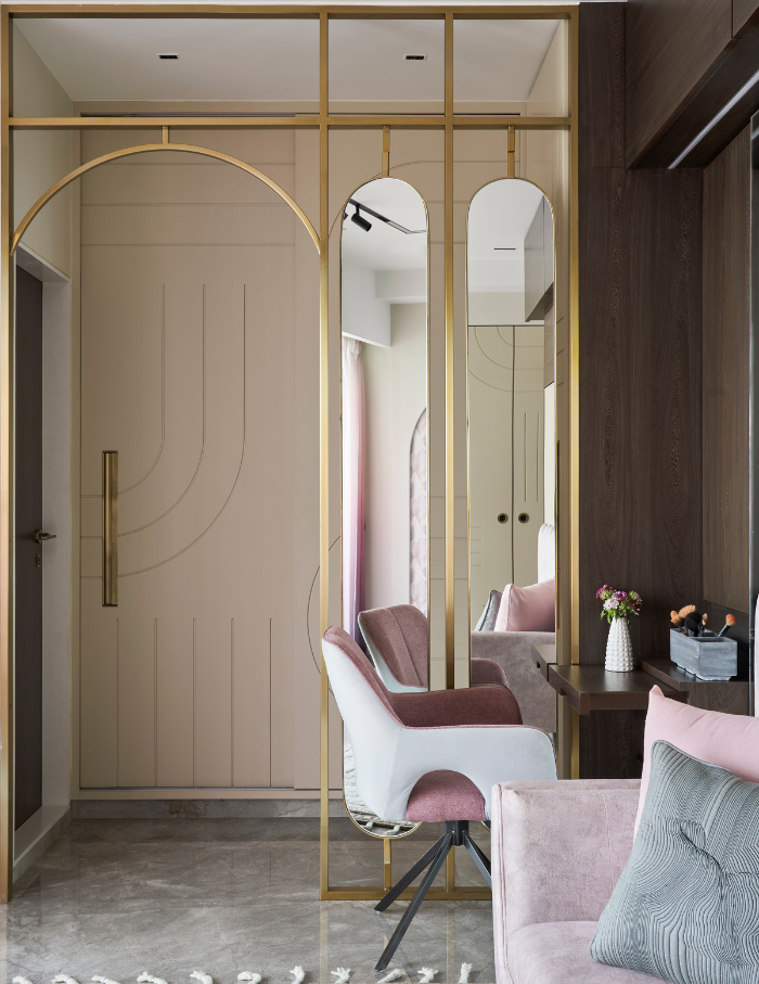 Make-up studio at home with interiors featuring state of the art mirrors and pastel pink chairs.