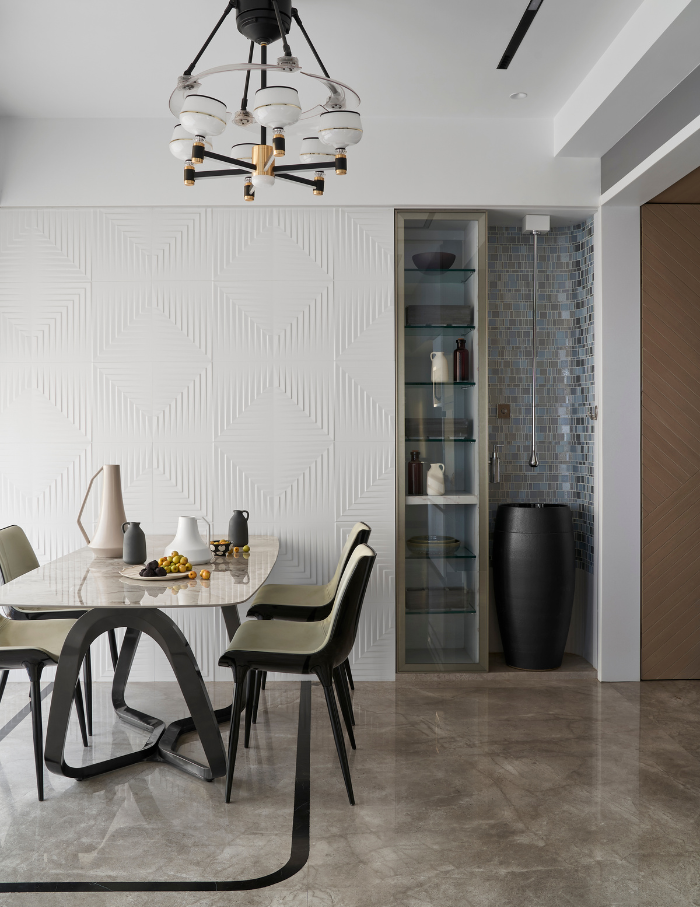 Family dining room with a unique dining table lit up with a modern light.