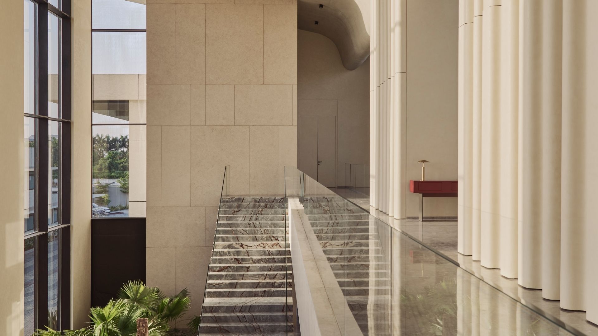 double height ceiling marble stairs