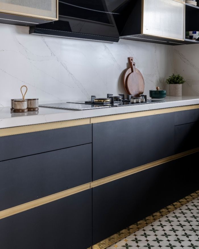 The kitchen features minimal drama with a patterned flooring furnished by Stanley Level Next; Photography by Prashant Bhat