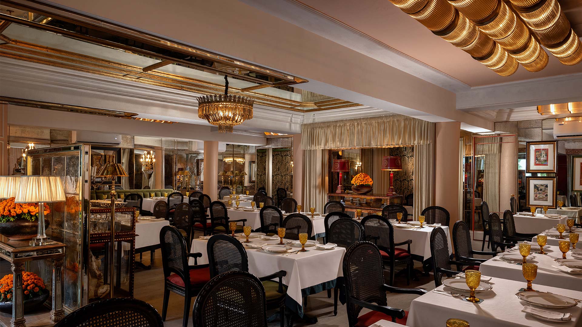 Black suede upholstered chairs under the mirror ceiling