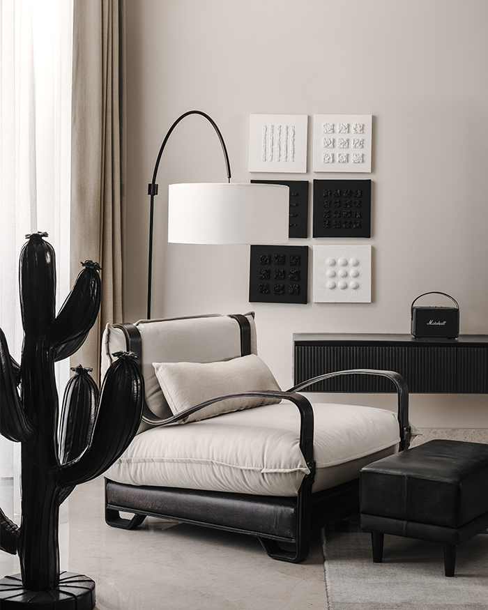 The monochrome side of Utsav. Floor lamp from Olie Lighting, lounge chair from Portside Café, artwork from Calcuttan and leather cactus from Portside Café; Styled by Styling Abode and Aman Issar; Photography by Tarang Goyal