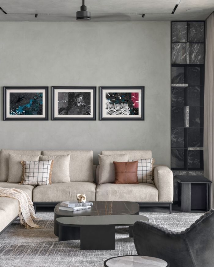 Artwork by Mona Rai creates a focal point with lighting from Flos above and a sofa by Alsorg below; Styled by Sakshi Pathak; Photography by Photographix