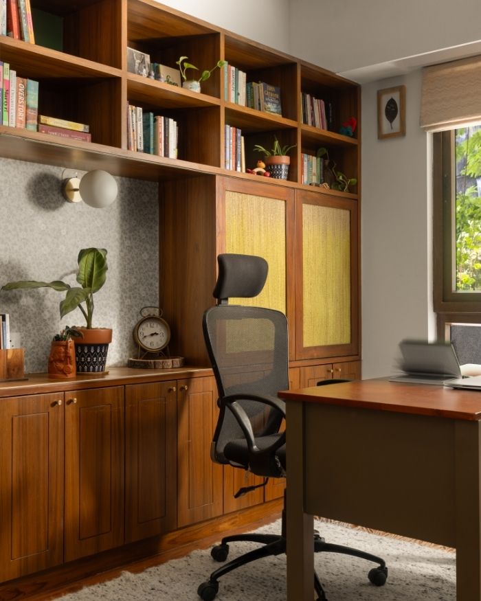 A banana fibre cupboard stands behind the study room desk, blinds from Petals; Photography by Roshan Sathish Paliath