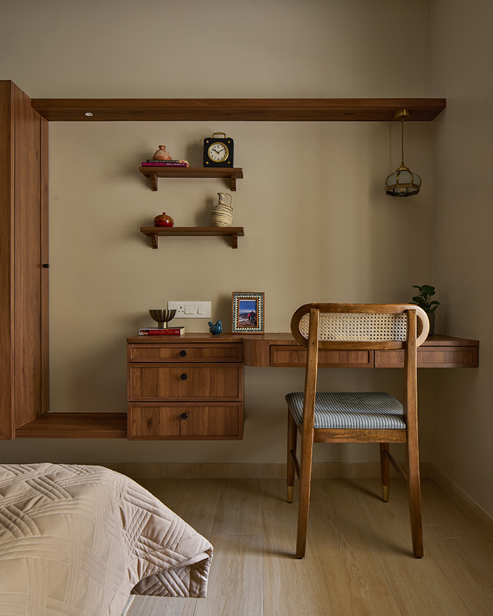 A built-in wooden desk and cane-backed chair create a focused study; Styling by Amol Nalavade; Photography by Manthan Yadav