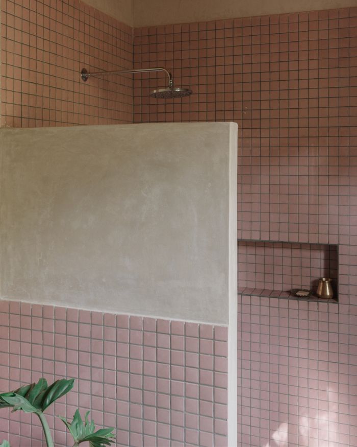 Soft pink tiles wrap the bathroom, adding a subtle graphic rhythm to the space; Styled by Imran Ali Khan and Rishad Patel; Photography by Shantanu Starick
