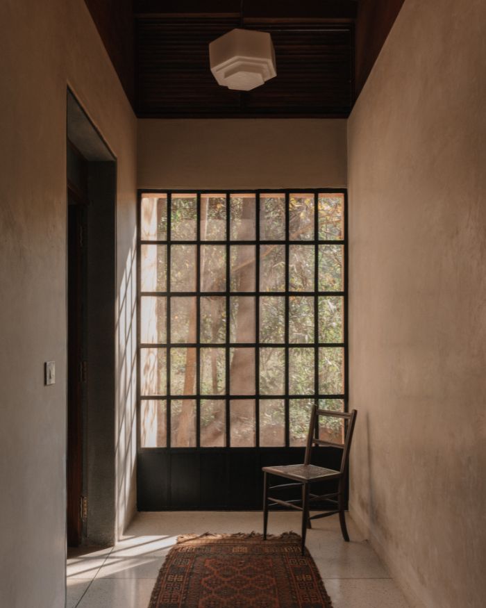 An art deco glass light from Taherally’s hangs in the passage outside the guest bedroom; Styled by Imran Ali Khan and Rishad Patel; Photography by Shantanu Starick