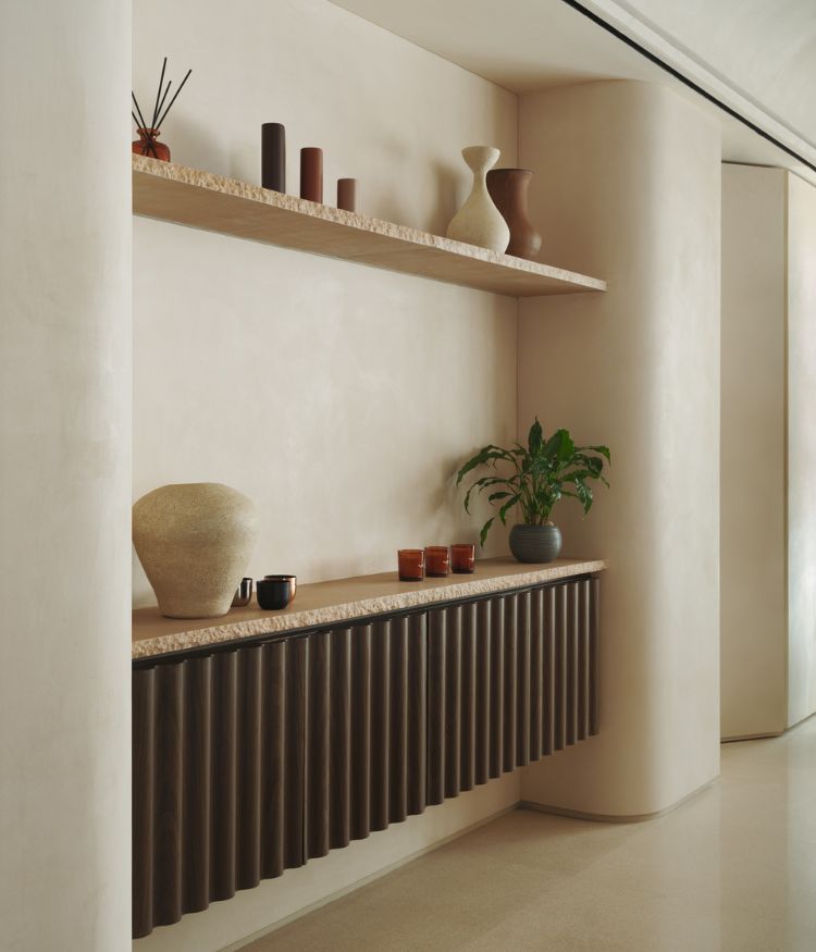 Minimalistic shelving and textured finishes create a curated vignette; Photography by Suleiman Merchant