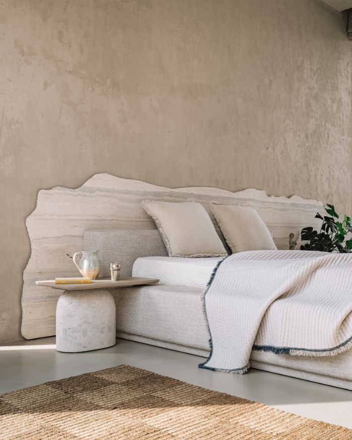 The bed with a jagged- edged marble headboard speaks the same language as the rest of the house. A surprising feat considering the climate consciousness that runs in parallel with the spatial considerations; Photography by Ishita Sitwala