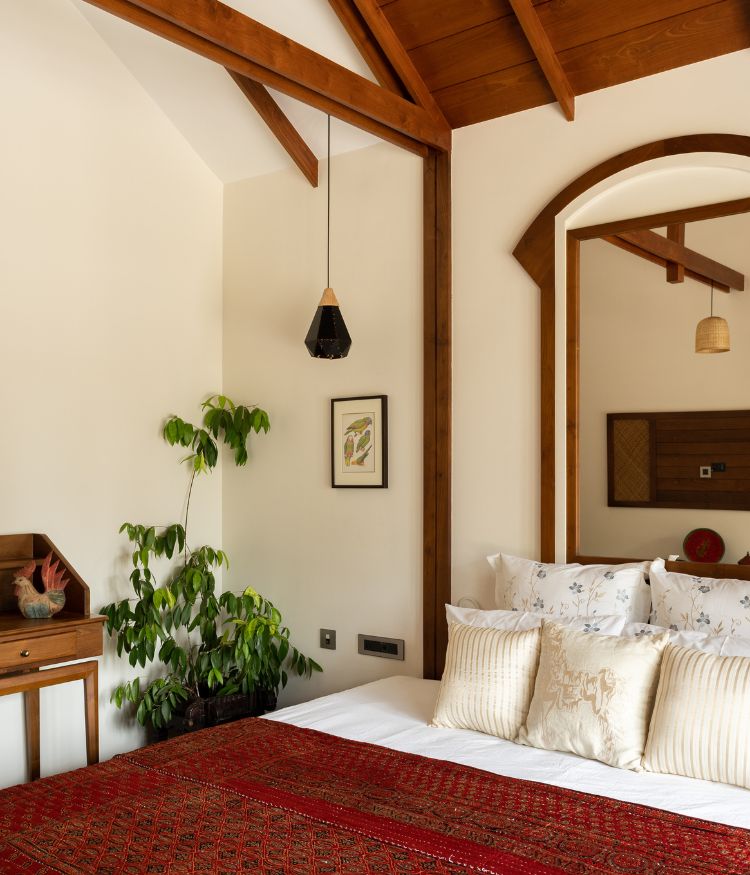 Sloping teak wood ceilings lend the rooms a colossal sense of scale. Colour makes a coy yet considered debut in the bedrooms; Photography by Syam Sreesylam