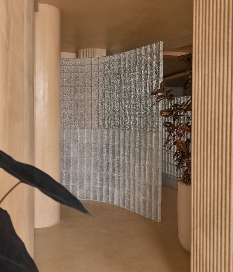 Curved glass brick partitions features fluted columns; Photography by Gokull Kadam