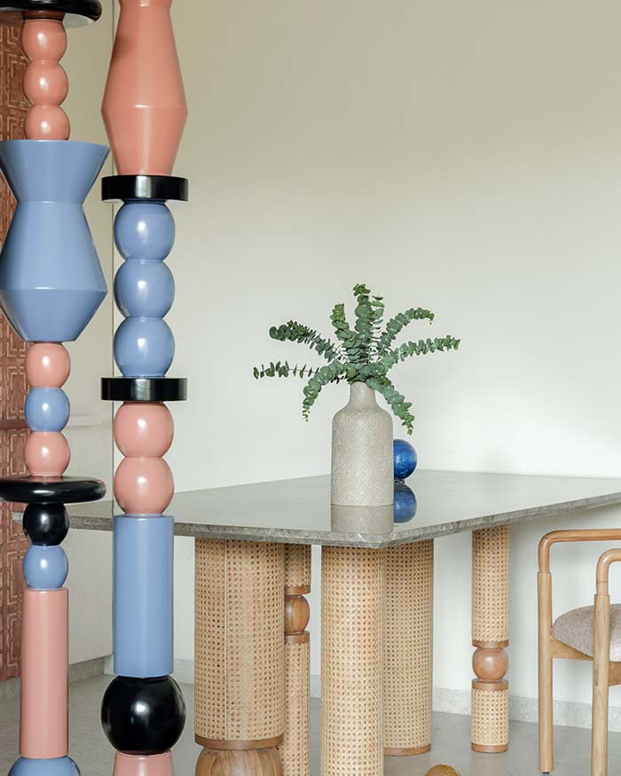 Sculptural columns in alternating hues frame the dining nook. Totem designed by Studio Osmosis and dining set by Musemart; Photography by Wabi-Sabi Studio