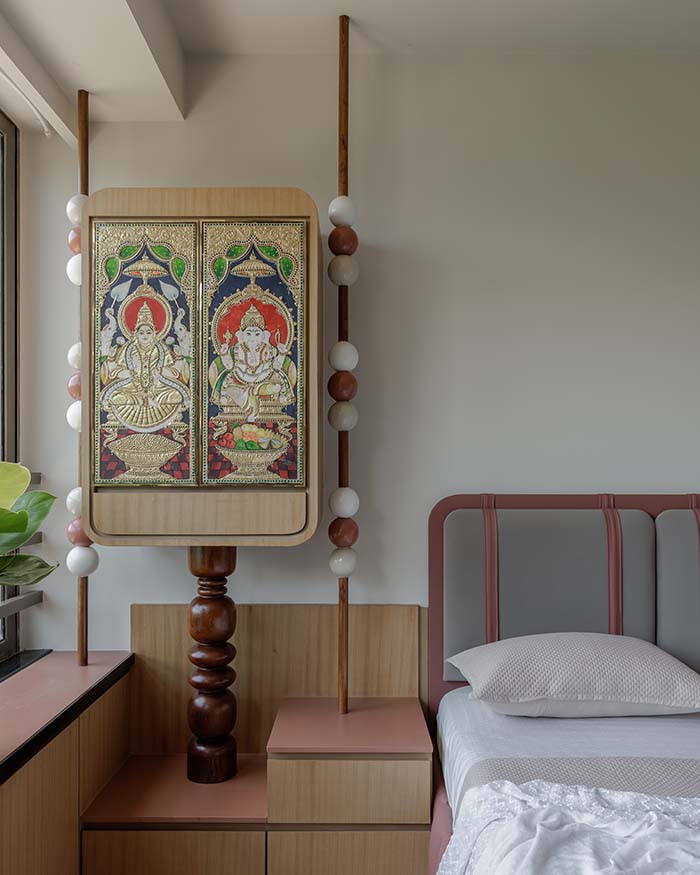 The bedside vignette blends devotional art within contemporary forms. Mandir and Totems are by Studio Osmosis. Shutter is repurposed Tanjore Art; Photography by Wabi-Sabi Studio