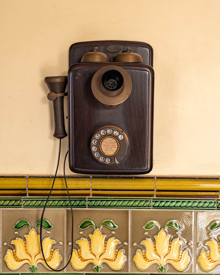 Objects such as the vintage rotary telephone paint a still life of the home’s past; Photography by Rohit Ganguly