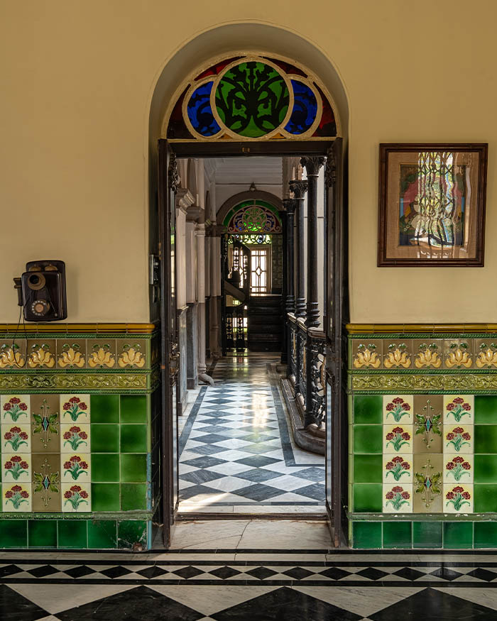 Carrying delicate floral motifs, the handmade tiles, dating back over a century from Portugal, make a pervasive appearance across the mansion; Photography by Rohit Ganguly