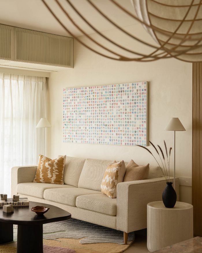 The living room makes space for comfort and conversation with the Arjunvir Gujral Design Studio sofa, accessorised with an Altrove throw; Styling by Riddhika Jesrani; Photography by @thekuber @evolve.studio_