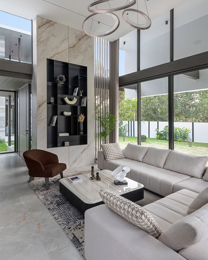 The living area combines marble finishes, pastel furnishings and lights by Hybec.
TV console by Lixil; Photography by Sebastian Zachariah, PHX India