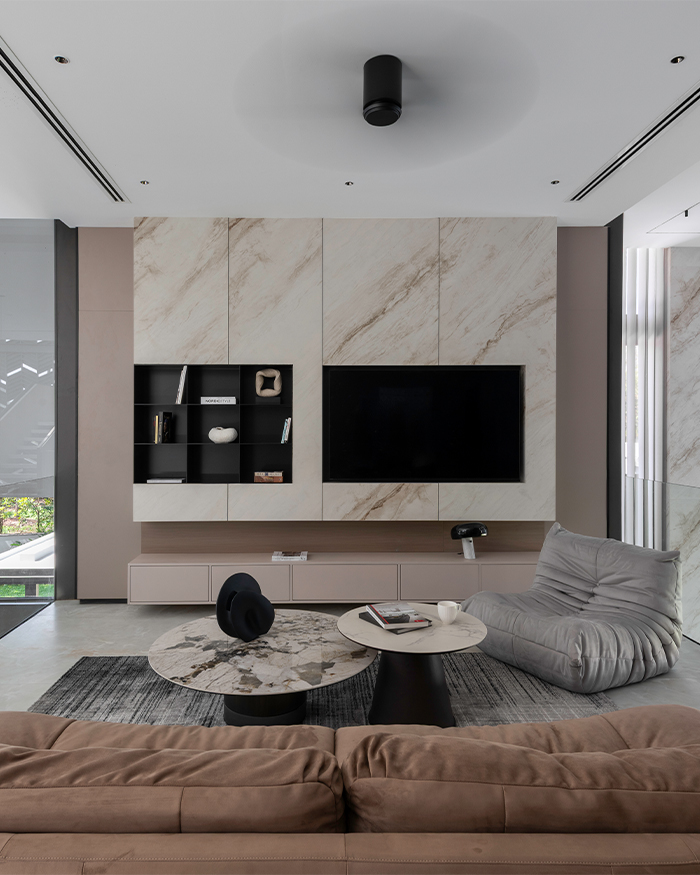 Pastel pink tones and marble finishes shape the theatre room overlooking the courtyard; Photography by Sebastian Zachariah, PHX India