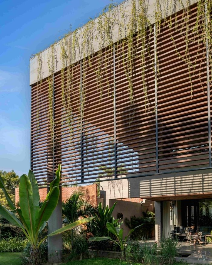 The shaded garden becomes the primary outdoor space, creating a verdant threshold between inhabitation and open sky; Styled by Saniya Tadha, Photography by Vinay Panjwani