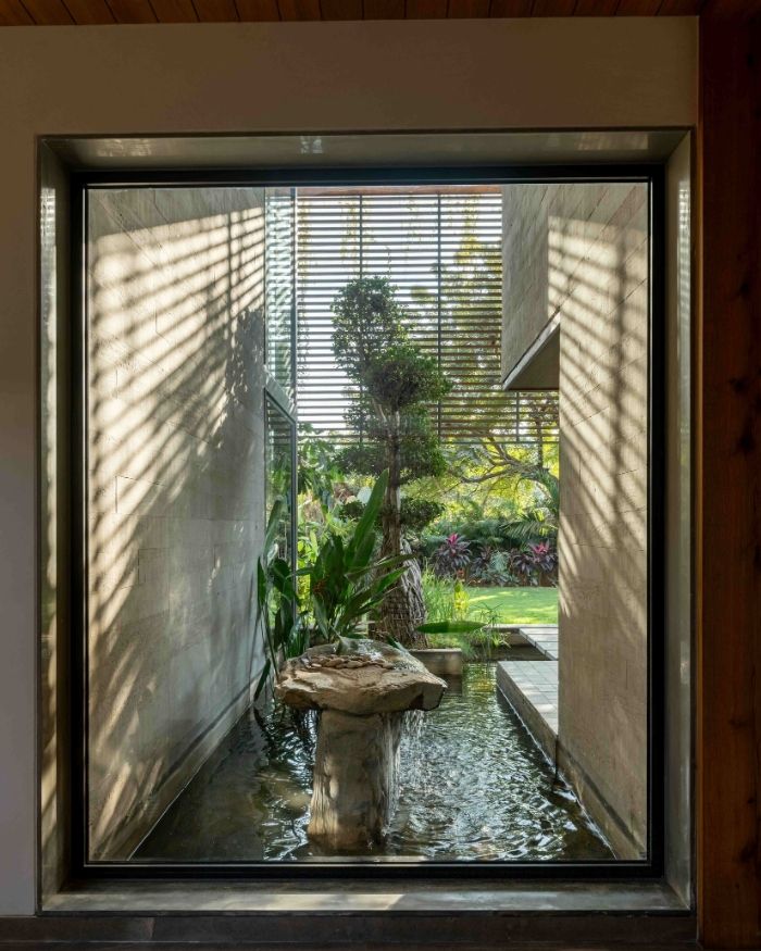 A vignette from the home’s entrance where water, natural stone and foliage unite; Styled by Saniya Tadha, Photography by Vinay Panjwani