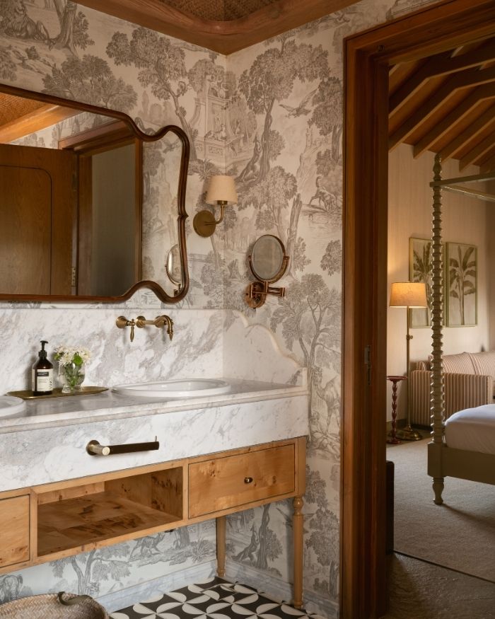 A Goan-inspired texture story, brought to life with KitKat tiles, a checkered wood-and-cane ceiling, and wallpaper finish by UDC Homes and bath fittings by Bathline Sensation India; Photography by Nayan Soni