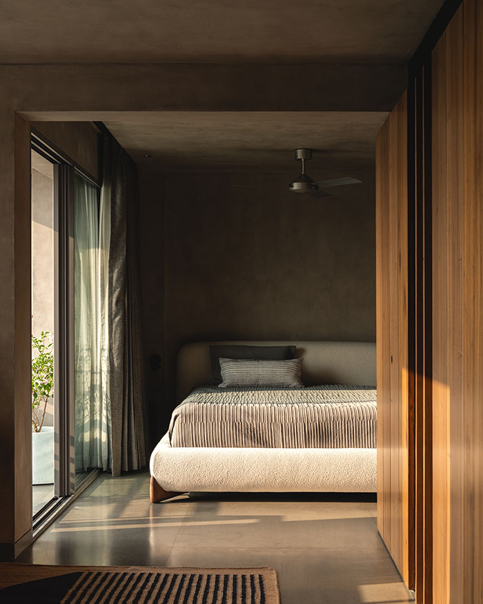 The sleeping zone features a bed and slimline aluminium sections for exterior continuity; Photography by Syam Sreesylam