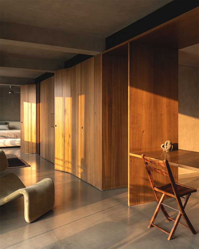 A central volume merges storage and subtle zoning while preserving spatial flow; Photography by Syam Sreesylam