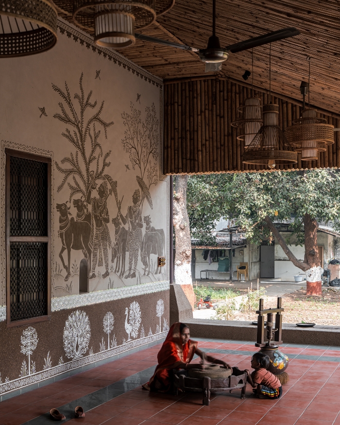 Terracotta underfoot, bamboo overhead, folk murals wrapping every wall like a saree border that never ends — and the organic produce
fallen from the farm, scattered across the floor as if the house itself is still feeding you; Styling by Priya Goyani; Photography by Tarun Hirpara