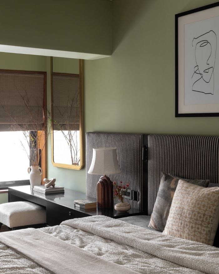 The bed-back detail serves as a stellar example of spatial utility in the master bedroom. The fabric headboard is from Pure Concept, and the bed linen and bedding from West Elm; Photography by Kuber Shah