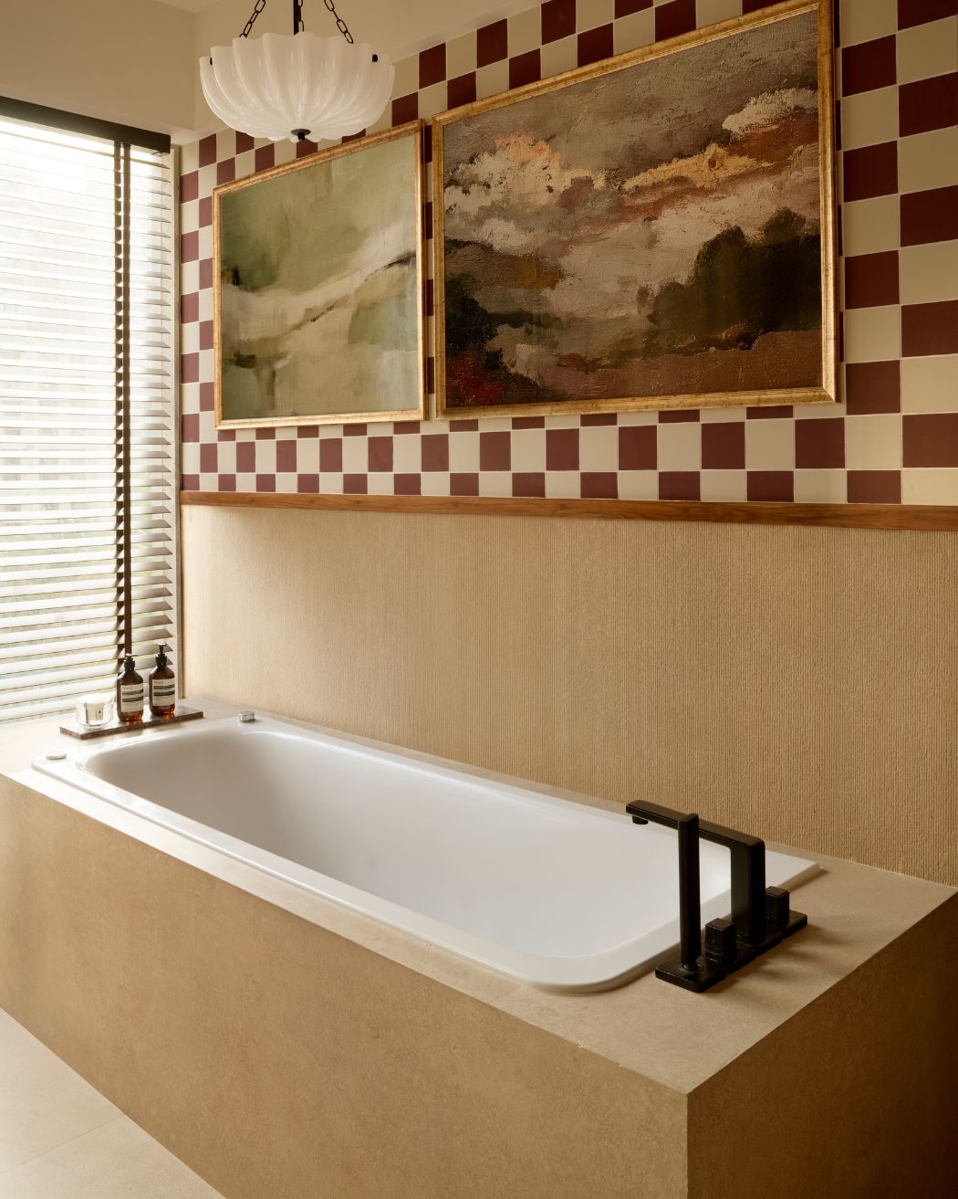 The smooth beige Kohler & Nexion Tiles makes a stunning backdrop for a sleek, white built in bathtub. Styled by Namrataa Shetty; Photography by Talib Chitalwala