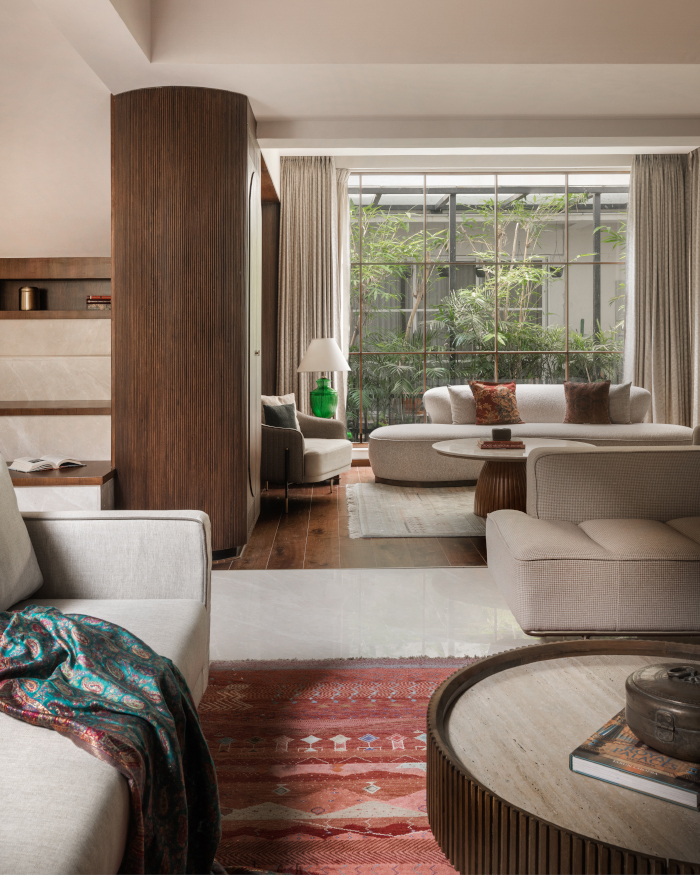 The Cavallo curved sofa and Parosa chair by Dtale Modern bring organic softness to the room, anchoring the Talbot centre table from Dtale Modern and a saddle daybed from Wooden it be nice; Styling by Apoorva Nayak, Photography by Arjun Krishna
