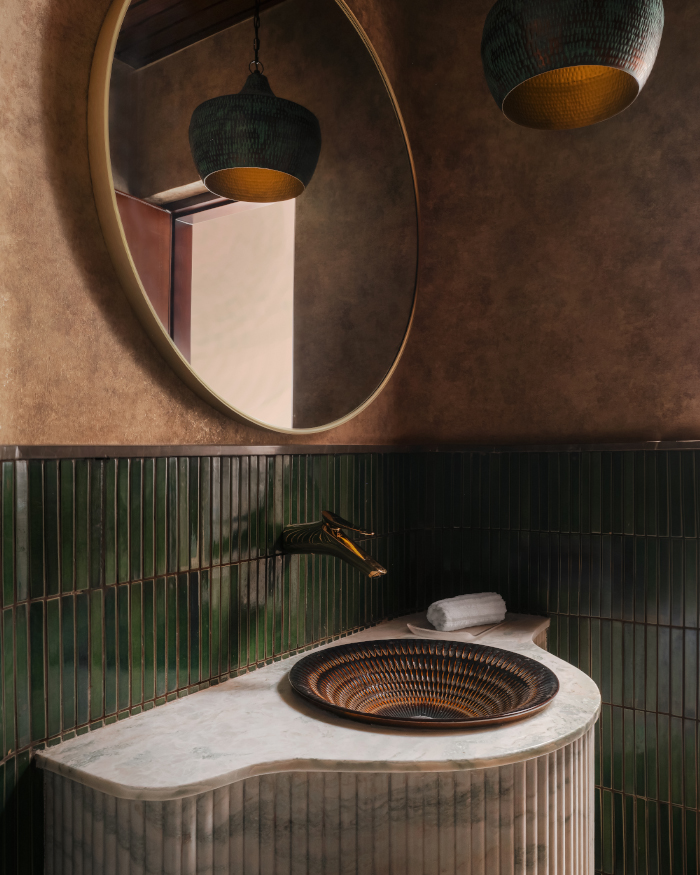 Wallpaper from Petals Furnishing complements the contrasts of the bottle green dado tiles; Styling by Apoorva Nayak, Photography by Arjun Krishna
