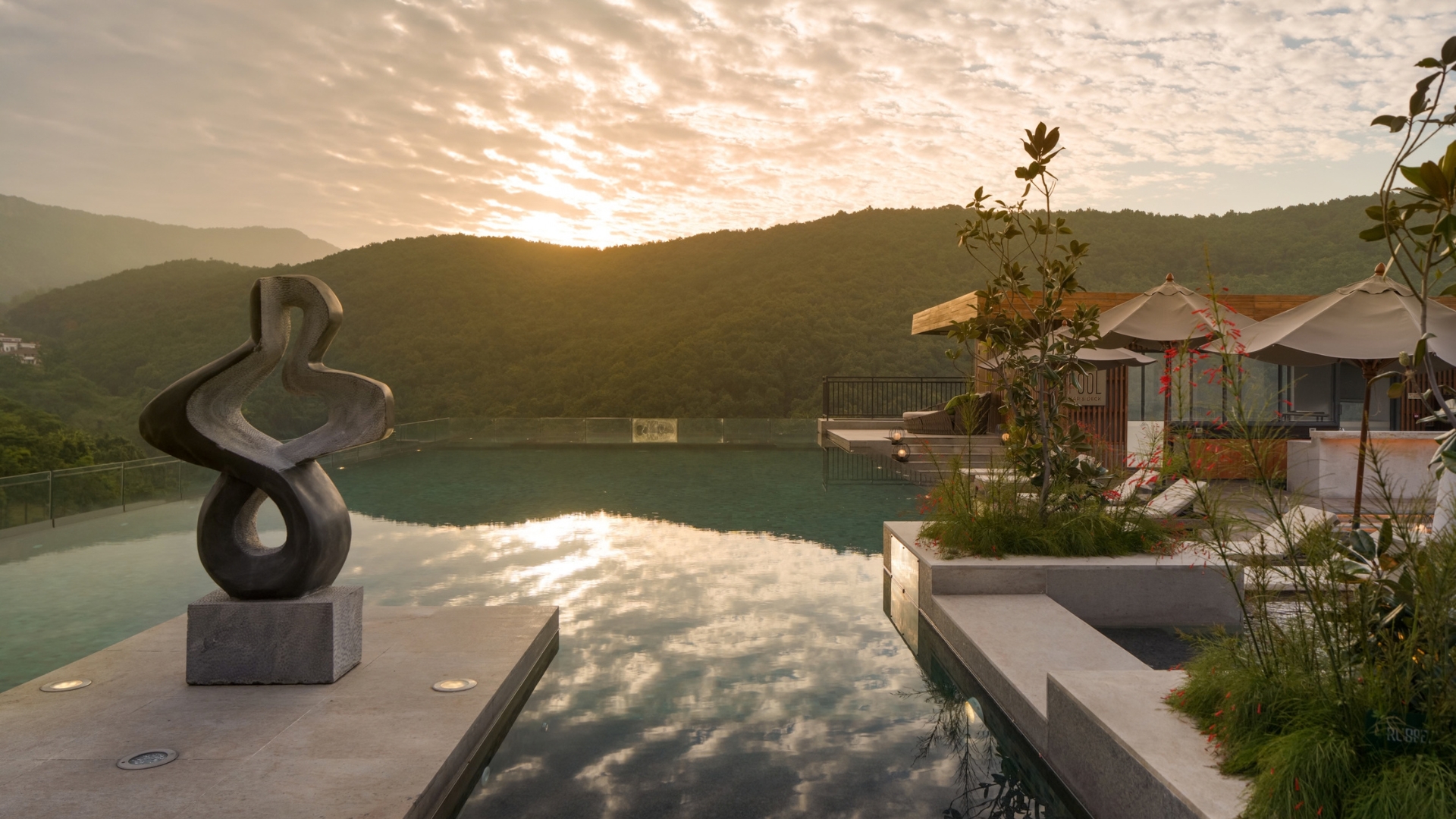 A design sculpture sits near a pool