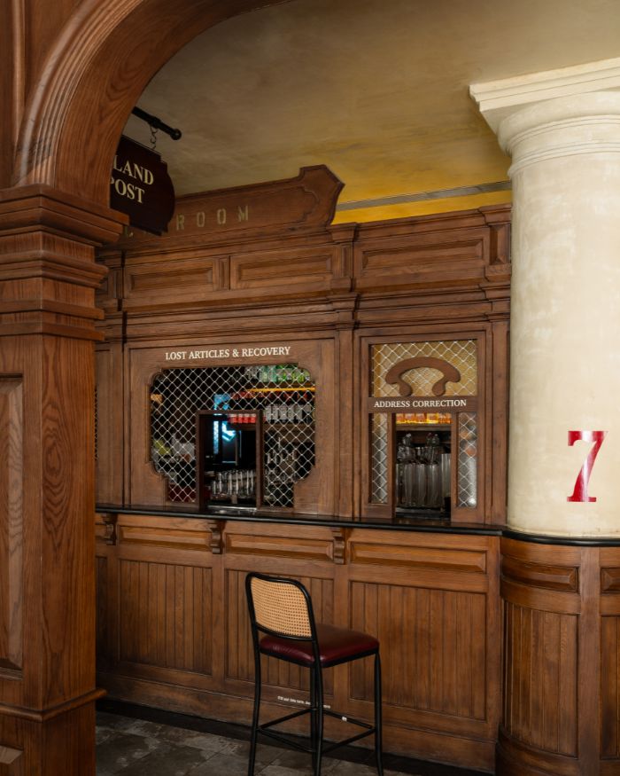A cane- topped stool near a Lost Articles and Recovery counter