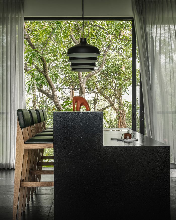 An open-plan kitchen customised on site using locally sourced designs and materials