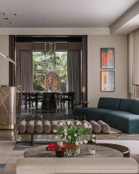 Heart of the home is the spacious living and dining area peppered with furniture from Virasp Bativala Associates and the Reeves Armchair from Minotti; Photography by Ishita Sitwala; Styling by Kunal Dass
