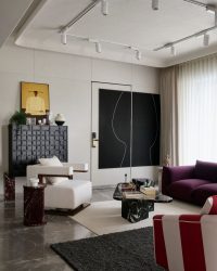 In the living room, the lush sofas are accompanied by Rosso Levanto marble side tables with props and accessories from H&M home. Styled by Namrataa Shetty; Photography by Talib Chitalwala