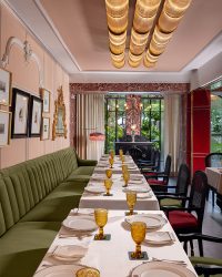 overhead salmon pink accent with high pillars andglass tube lighting