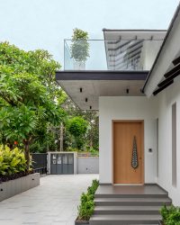 noteworthy wooden door at the stone stepped stairway