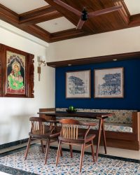 V4_kapok The dining space blends Indian traditionality with a Greek-inspired blue backdrop, as artwork from Rijesh K. and Lakshmi Ethiraj Gallery adorn the walls; Photography by Yash R. Jain
