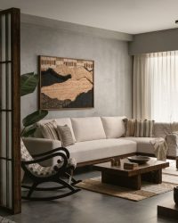 The living room features a jute artwork from Moire, along with a jute rug from Obeetee; Photography by Nayan Soni