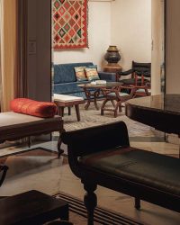 Acting as the connective core of the house, the family living and dining spaces link the bedrooms, kitchen, courtyards, and vertical circulation; Photography by Studio Beyond Walls